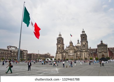 Mexico City, Mexico - March 23, 2012:  Mexico City Metropolitan Cathedral And Mexican Flag At Zócalo In Mexcio City, Mexico