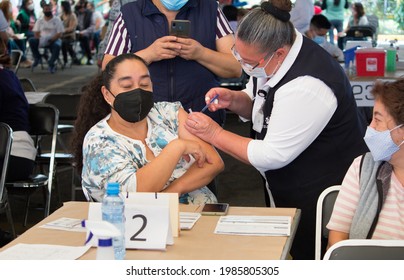 Mexico City, Mexico - May 20, 2021: A 50 Plus Year Old Woman Receives The First Dose Of Russian Vaccine Sputnik V During Vaccination Campaign Against COVID-19 In Mexico City