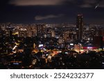 Mexico City Night Skyline, Skyscrapers and Illuminated Buildings in Ciudad de México: Beautiful vibrant historic metropolis at an altitude of 7,350 ft.