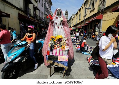 Mexico City, Mexico - October 18, 2021: An Image Of Our Lady Of The Holy Death Or La Santa Muerte, A Mexican Female Deity, Is Seen In A Shopping Commercial Street Of Downtown CDMX.