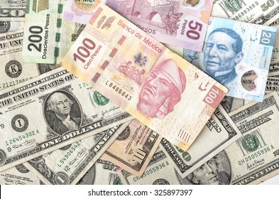 MEXICO CITY / MEXICO - SEPTEMBER 14 2015: Dollar And Mexican Peso Exchange Rate, Assorted Bills Cash Pile Background