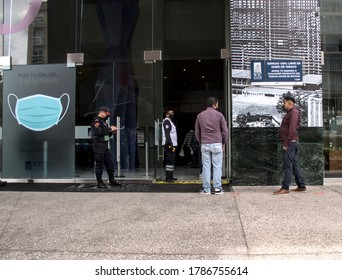 Mexico city/Mexico; 07 29 2020: temperature control in the main entrance of the World Trade Center Mexico city, citizens respecting social distancing, public security personel