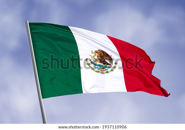 Mexico flag isolated on sky\
background. close up waving flag of Mexico. flag symbols of\
Mexico.