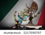 Mexico flag with statue of lady justice, constitution and judge hammer on black drapery. Concept of judgement and punishment