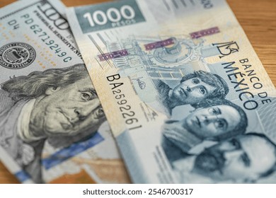 Mexico money , Exchange rate, peso vs dollar. Financial concept. 1000 Mexican pesos and 100 US dollars. Close up