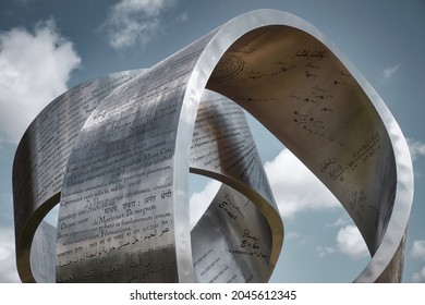 MEYRIN, CANTON OF GENEVA, SWITZERLAND - AUGUST 31, 2021: Steel sculpture "Wandering the immeasurable" by artist Gayle Hermick at CERN. Shaped like a ribbon, it honors great discoveries in physics.