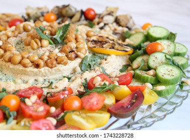 Mezze Platter With Humus, Pita, And Vegetables