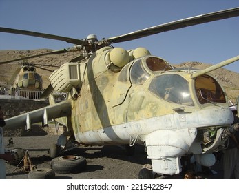 Mi-24 Helicopter Gunship Built In Russia Given To Afghan Army, Now On Display Outside Herat. Behind It Is A Mi-8 Helicopter.