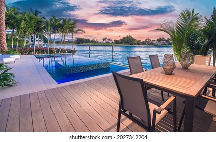 Miami Beach - April 2020: View Of Patio Deck With View Of Infinity Pool And Bay. Afternoon Shot Of A Luxury Home.