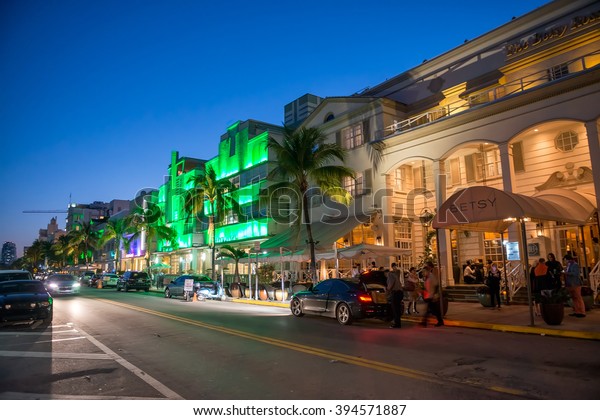 MIAMI BEACH -\
FEBRUARY 25, 2016: Streets of Miami Beach at night. Miami welcomes\
15 million tourists every\
year.