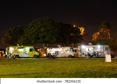 MIAMI BEACH, FL, USA - DECEMBER 26, 2017: Night Photo Of Food Trucks In Haulover Park Held Every Tuesday Night