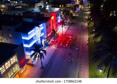 MIAMI BEACH, FL, USA - JUNE 16, 2020: Aerial Night Photo Tourists Returning To Miami Beach During Phase 1 Reopening Coronavirus Covid 19 Pandemic 2020