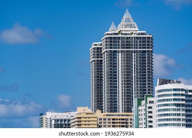 MIAMI BEACH, FL, USA - MARCH 13, 2021: Blue And Green Diamond Towers In Miami Beach On Blue Sky