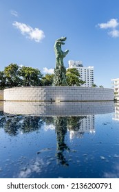 MIAMI BEACH, FL, USA - OCTOBER 14, 2019: The Holocaust Memorial In Miami Beach Features A Reflection Pool With A Hand Reaching Up And Bodies Climbing,  A Memorial Wall, And Memorial Bridge.