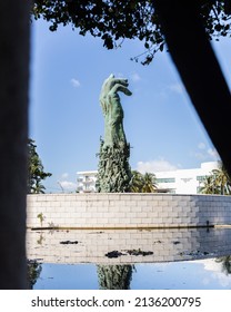 MIAMI BEACH, FL, USA - OCTOBER 14, 2019: The Holocaust Memorial In Miami Beach Features A Reflection Pool With A Hand Reaching Up And Bodies Climbing,  A Memorial Wall, And Memorial Bridge.