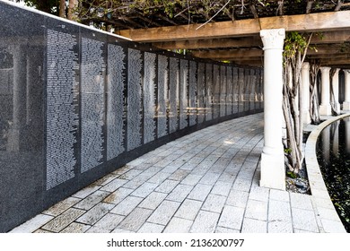 MIAMI BEACH, FL, USA - OCTOBER 14, 2019: The Holocaust Memorial In Miami Beach Features A Reflection Pool With A Hand Reaching Up And Bodies Climbing,  A Memorial Wall, And Memorial Bridge.