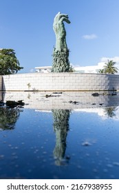 MIAMI BEACH, FL, USA - OCTOBER 14, 2019: The Holocaust Memorial In Miami Beach Features A Reflection Pool With A Hand Reaching Up And Bodies Climbing,  A Memorial Wall, And Memorial Bridge.