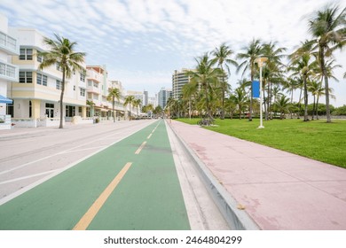 Miami Beach FL USA stock image. View from bike lane north Lummus Park and hotels on Ocean Drive - Powered by Shutterstock