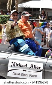 MIAMI BEACH, FLORIDA, APRIL 9, 2016: The 8th Annual Miami Gay Pride, Ocean Drive In Miami Beach, Florida. Lesbian, Gay, Bi, Transgender Celebrate. Happy Older Gays Couple. 