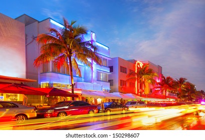 Miami Beach, Florida illuminated hotels and restaurants at sunset on Ocean Drive, world famous destination for nightlife, beautiful weather and pristine beaches