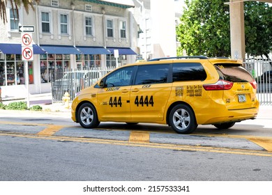 Miami Beach, Florida USA - April 14, 2021: Toyota Yellow Cab Taxi Car On The Road, Side View