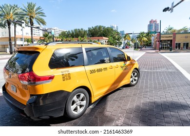 Miami Beach, Florida USA - April 14, 2021: Toyota Springs Cab, Side View. Yellow Taxi Car