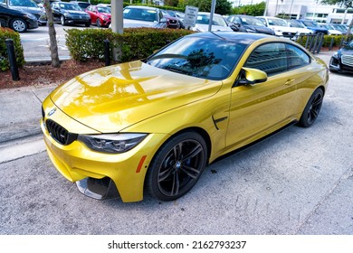 Miami Beach, Florida USA - April 15, 2021: Yellow Bmw M4, Corner Top View. Luxury Sportcar