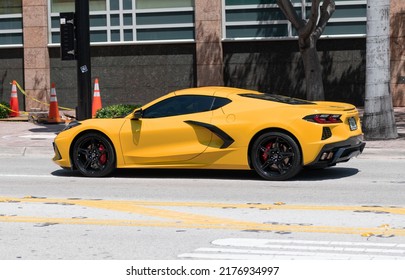 Miami Beach, Florida USA - April 15, 2021: Orange Chevrolet Corvette Sportcar, Side View