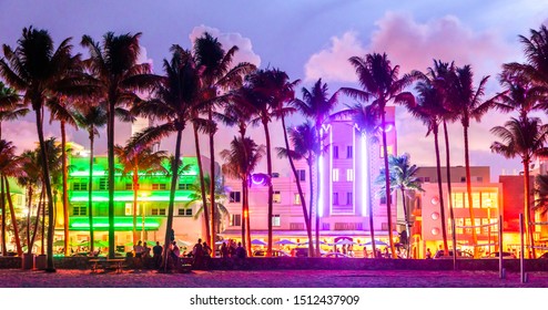 Miami Beach Ocean Drive Hotels And Restaurants At Sunset. City Skyline With Palm Trees At Night. Art Deco Nightlife On South Beach