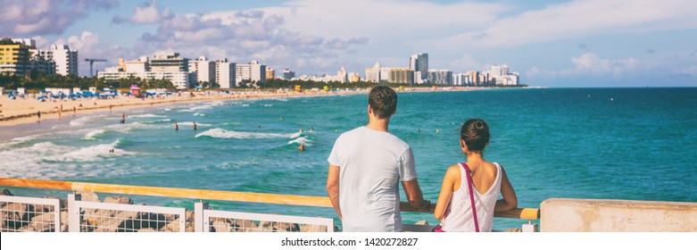 Miami Beach People Lifestyle Young Tourists Couple Walking In South Beach, Miami, Florida. USA Travel. Panoramic Banner Background.