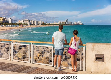 Miami Beach People Lifestyle Young Tourists Couple Walking In South Beach, Miami, Florida. USA Travel.