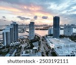 Miami Beach, South Beach at night. Miami seaside at dusk. Aerial view of evening Miami Beach and cityscape. Coastline of Miami Beach night shot from the air drone.