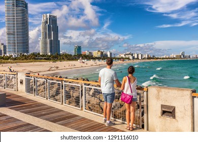 Miami beach tourists couple walking in South Beach, Miami, Florida. USA travel. - Powered by Shutterstock