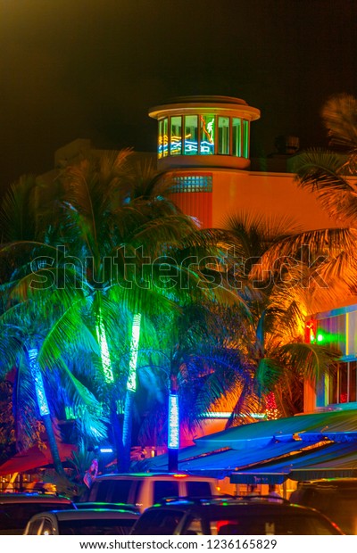 MIAMI BEACH, USA - AUG\
3, 2010: Night view at Ocean drive  in Miami Beach, Florida. Art\
Deco Night-Life in South Beach is one of the main tourist\
attractions in Miami.
