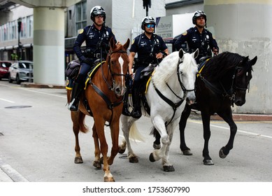 Miami Downtown, FL, USA - JUNE 4, 2020: Three Police Officers On Horseback