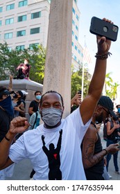 Miami Downtown, FL, USA - MAY 31, 2020: Protests During A Coronavirus Pandemic. Black Man In A Protective Mask Against Viruses. US Racial Inequality