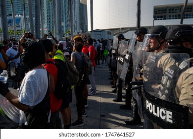 Miami Downtown, FL, USA - MAY 31, 2020: US Police And Protesters.The Protests Have Spread To Cities Across The United States. Miami Protest Live. Police And Protesters. George Floyd Death