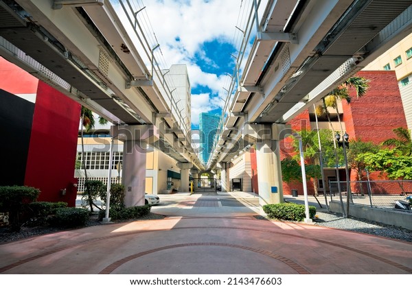 Miami downtown street view under mover\
train track, Florida state, United States of\
America