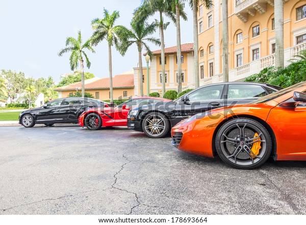 MIAMI, FL - DECEMBER 2, 2013: the famous\
Biltmore Hotel and sport cars.It was the set of various films like\
Bad Boys 2,Miami Vice and\
CSI:Miami