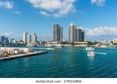 Miami, FL, United States - April 28, 2019: Luxury high-rise condominiums overlooking boat traffic on the Florida Intra-Coastal Waterway (Meloy Channel) in Miami Beach, Florida, USA.