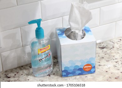 Miami, FL, USA - April 01, 2020: Germ-X Hand Sanitizer And Kleenex Tissue Box, Anti Viral, On Marble Surface For Killing Germs Due To The COVID-19 Pandemic Also Known As The Coronavirus. 