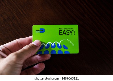 Miami, FL /USA - August 24, 2019: Male Hand Holding A Miami Dade County, Easy Transit Card