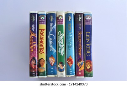 Miami, FL, USA- Feb 10, 2021: Old vintage Disney VHS movie video tapes, classic children's movies. Aladdin, Pocahontas, Cinderella, Snow White, The Little Mermaid, Beauty and the beast, The Lion King