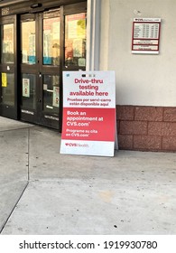 Miami, Fl, USA: Feb 18, 2021: CVS Pharmacy Bilingual Outdoor Sign For Drive Thru COVID-19 Testing And Website To Book An Appointment