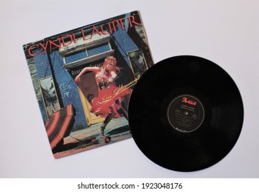 Miami, Fl, USA: Feb 20, 2021: Pop and new wave artist, Cyndi Lauper music album on vinyl record LP disc. Titled: She's So Unusual album cover
