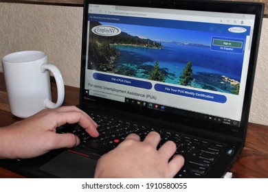 Miami, FL, USA- Feb 5, 2021: Person Living Out Of State Applying For Unemployment Insurance Benefits Using Nevada's Website Under The CARES Act Due To COVID19 Pandemic, Corona Virus, Pua Peuc Fpuc 