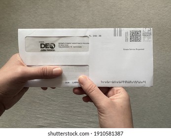 Miami, FL  USA - Feb 5, 2021: A Letter In The Mail Arrives From The DEO, Department Of Economic Opportunity, Regarding Unemployment Benefits Due To COVID-19 Pandemic, Corona Virus 