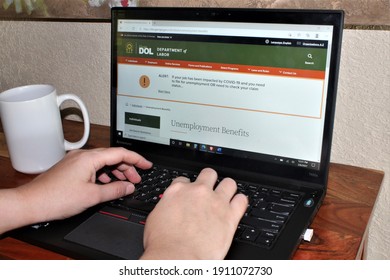 Miami, FL, USA- Feb 6, 2021: Person Living Out Of State Applying For Unemployment Insurance Benefits Using Georgia's DOL Unemployment Website Under The CARES Act Due To COVID19 Pandemic Pua Peuc Fpuc 