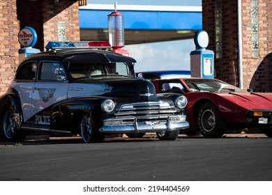 Miami, FL, USA - JUNE, 2020: Police Car. Black Elegant Super Car In A Sunny Street In The US. Retro Travel Jorney Life Style