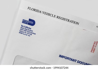 Miami, FL, USA- June 2021: DMV Florida registration tag renewal service notice letter for Miami Dade County Tag agency. Florida Vehicle Registration